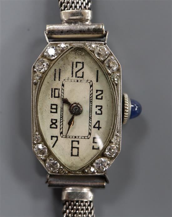 A ladys white metal and diamond set cocktail watch, on a 9ct white gold mesh link bracelet.